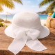 Straw hat with white bow