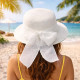 Straw hat with white bow